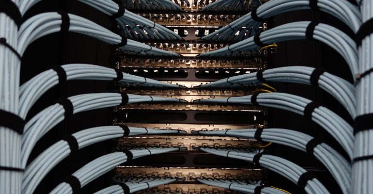Patch cables dressed into rack-mounted patch panels