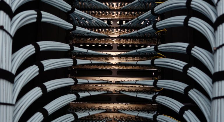 Patch cables dressed into rack-mounted patch panels