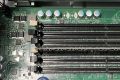Server motherboard memory slots opened during a memory expansion, one module seated