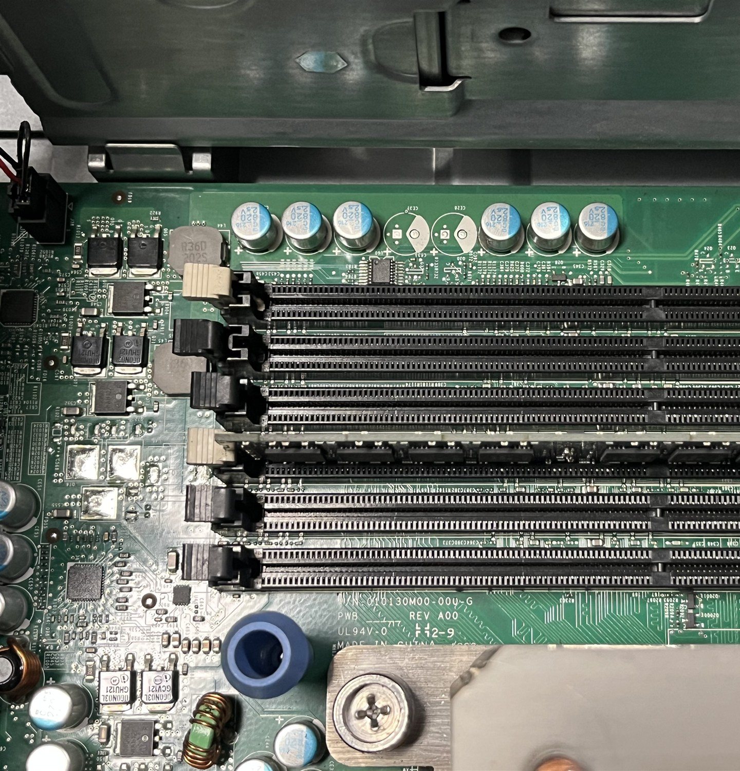 Server motherboard memory slots opened during a memory expansion, one module seated