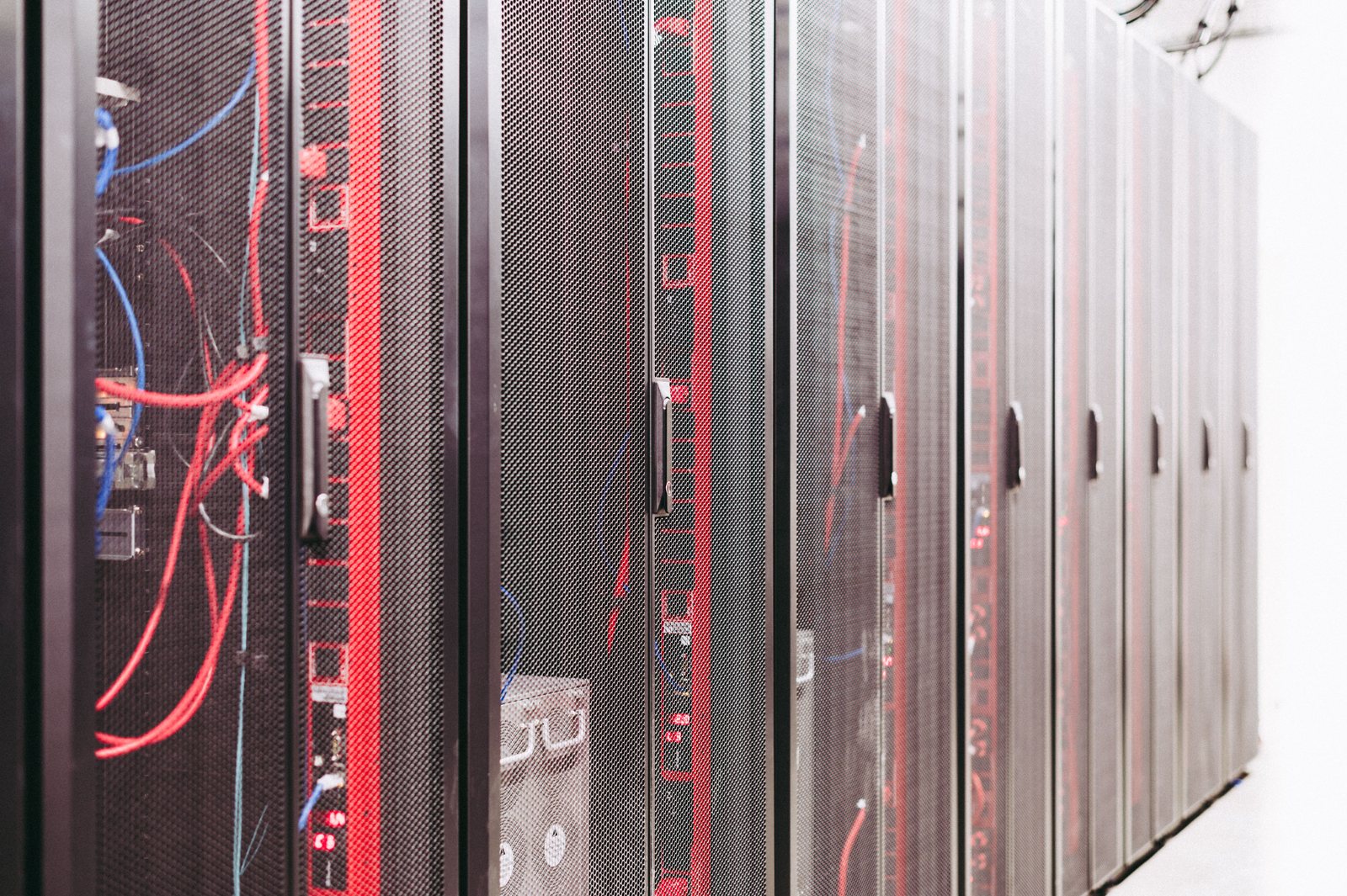 Row of server racks with color-coded patch cabling